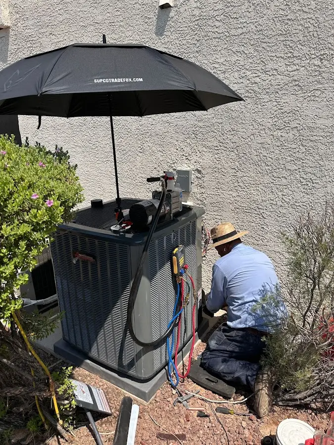 HVAC technician performing outdoor AC maintenance in Centralia